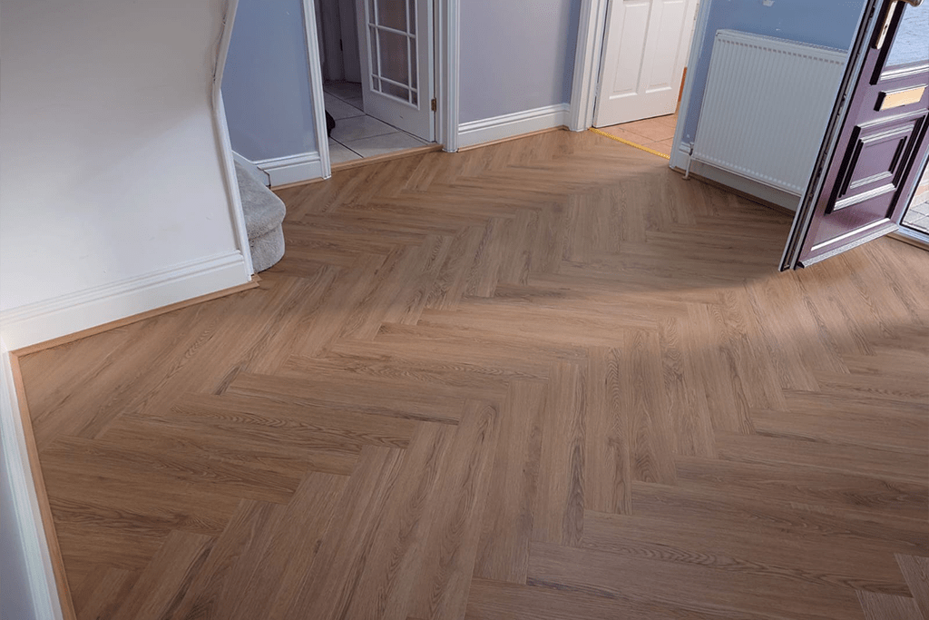 Herringbone laminate flooring installation in a North London home by Carpet Masters
